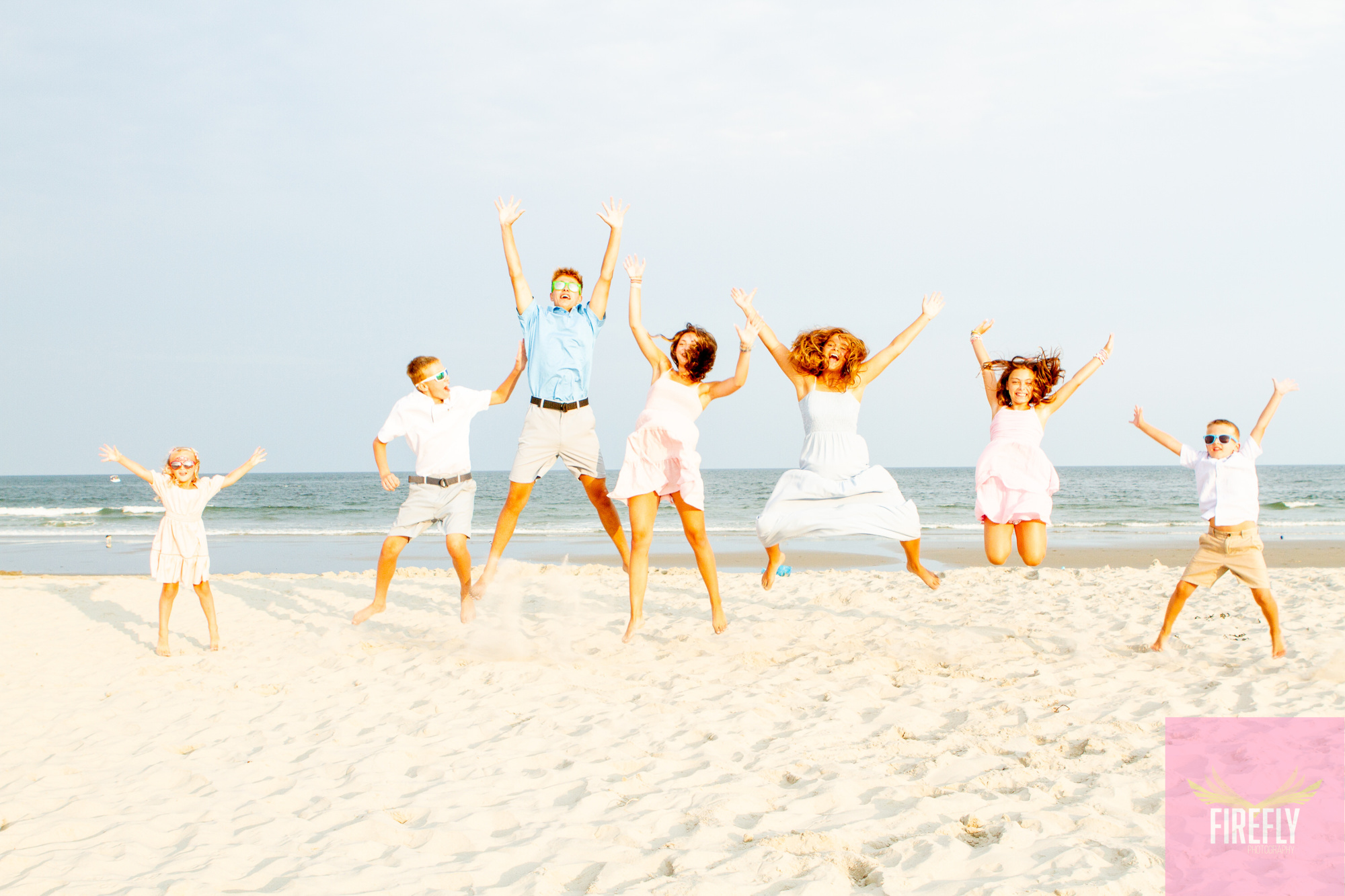 Kids jumping for joy on the beach